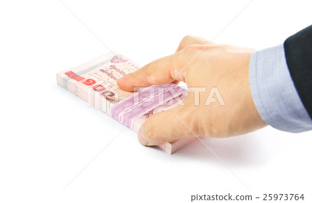 Hand holding a bulk of 100 baht Thailand banknote Hand holding a bulk of 100 baht Thailand banknote 25973764