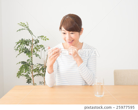 A woman rejoicing with a fall in fever 25977595