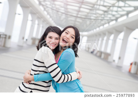two beauty woman hug together two beauty woman hug together 25977893