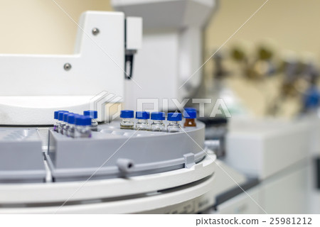 Vials in the autosampler tray. Chemistry lab Vials in the autosampler tray. Chemistry lab 25981212