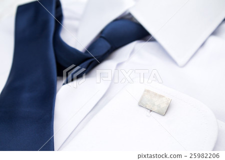 Man's white shirt with blue tie and cufflinks 25982206