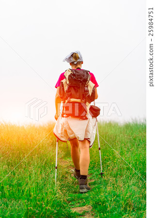 Woman hiker meadow sun Woman hiker meadow sun 25984751