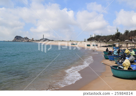 tropical beach and basket boats in fishing village 25984814