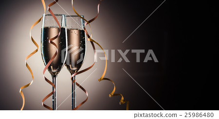 Two glasses filled with champagne ready to party Two glasses filled with champagne ready to party 25986480