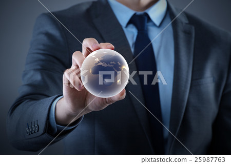 Businessman holding globe in global business 25987763