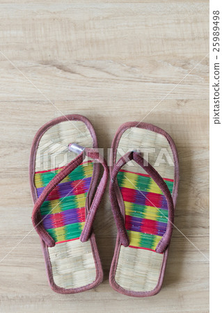 spa cozy weave sandal on wooden floor. 25989498