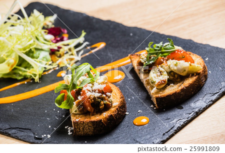 crostini on the black board 25991809