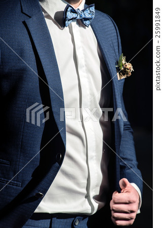 elegant groom 25991849