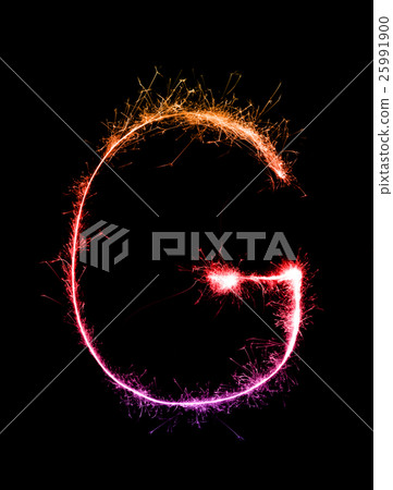 Sparkler firework light alphabet G at night Sparkler firework light alphabet G at night 25991900