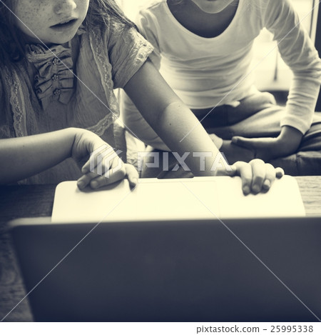 Girls Using Computer Concentrated Concept Girls Using Computer Concentrated Concept 25995338