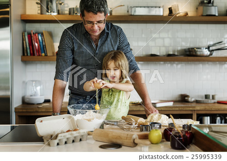 Family Father Girl Making Cookies Learning Baking Concept 25995339
