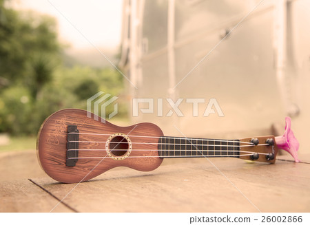 Ukulele vintage stone floor. 26002866