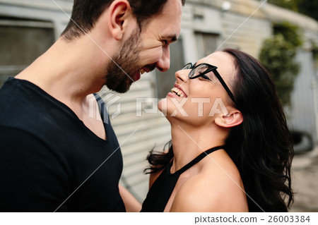 guy and girl in each other's arms 26003384