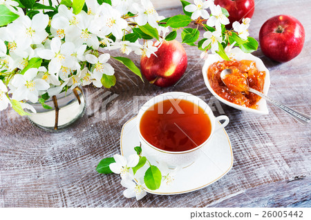 Cup of tea on wooden table and apple jam Cup of tea on wooden table and apple jam 26005442