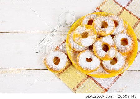 Donuts served on yellow plate top view copy space Donuts served on yellow plate top view copy space 26005445
