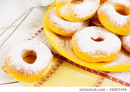 Donuts with caster sugar on checkered napkin Donuts with caster sugar on checkered napkin 26005446