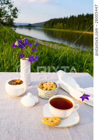 Evening tea sunset river view 26005447
