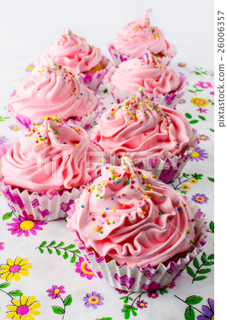 Pink birthday cupcakes  with whipped cream 26006357