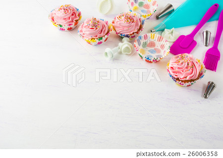 Pink cupcakes  and cookware invitation background 26006358