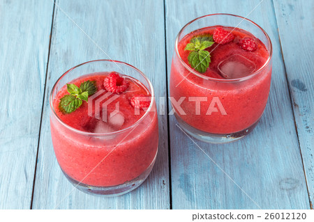 two glasses of berry smoothie two glasses of berry smoothie 26012120