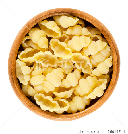 Gnocchi pasta in wooden bowl over white Gnocchi pasta in wooden bowl over white 26014744
