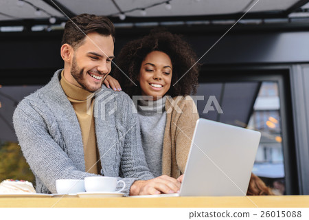 married couple in domestic wear browsing the 26015088