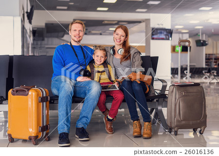 Family waiting for departure at airport 26016136