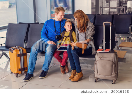 Family waiting for departure at airport 26016138