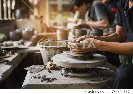 potter's hands make an earthen pot 26021857