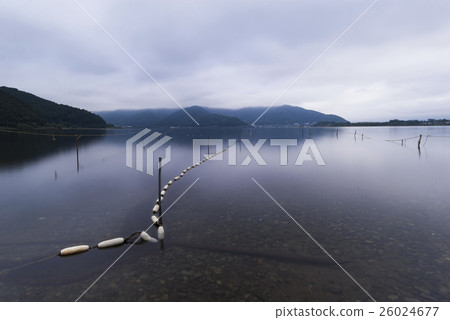Fisherman floats on Lake Kawaguchiko, Yamanashi Fisherman floats on Lake Kawaguchiko, Yamanashi 26024677