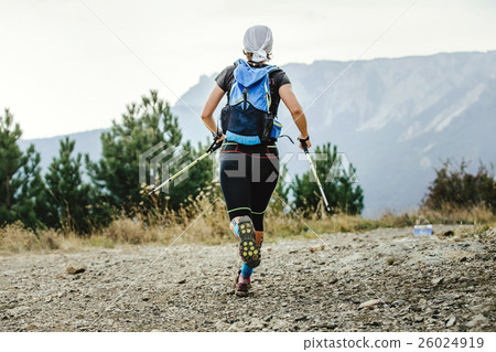 closeup female runner with walking stick nordic 26024919
