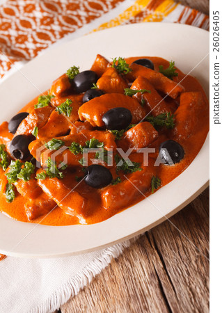 Spanish pork Raxo in a sauce of wine, tomatoes 26026405