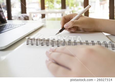 Woman reading book in library. Woman reading book in library. 26027314