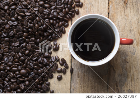 topview of the red cup of coffee and coffee beans 26027387