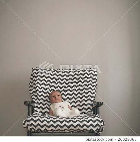 cute newborn baby sitting in the big chair cute newborn baby sitting in the big chair 26029365
