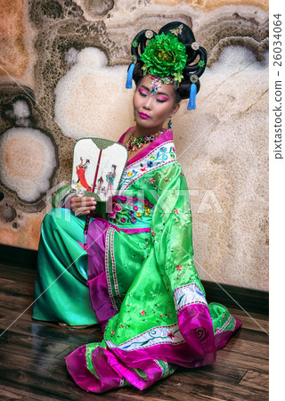 asian woman wearing chinese traditional dress asian woman wearing chinese traditional dress 26034064