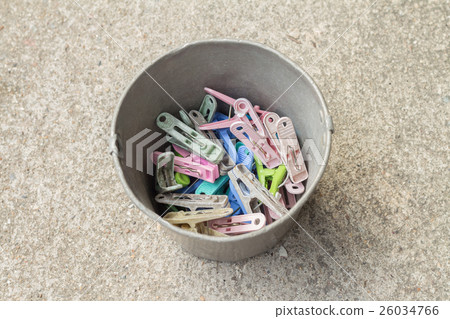 multi-coloured clothes pegs in bucket multi-coloured clothes pegs in bucket 26034766
