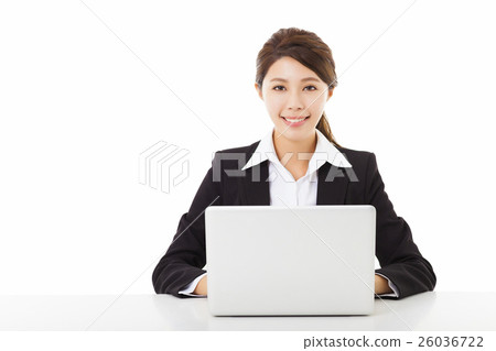 smiling young business woman working with laptop smiling young business woman working with laptop 26036722