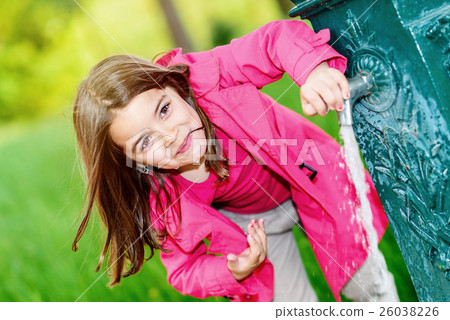 cute kid about to drink water in a fountain cute kid about to drink water in a fountain 26038226