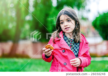 cute girl with cookies in the hands 26038248