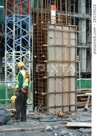 Construction workers fabricating timber form work  26039028