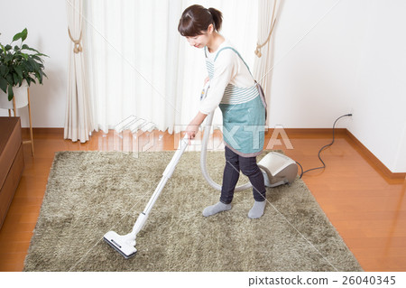 A young lady wearing a vacuum cleaner 26040345