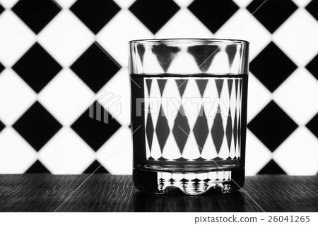 glass of water on a background geometric shapes glass of water on a background geometric shapes 26041265