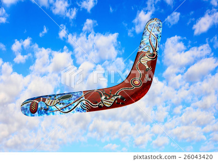 Australian boomerang flies in sky against of cloud 26043420