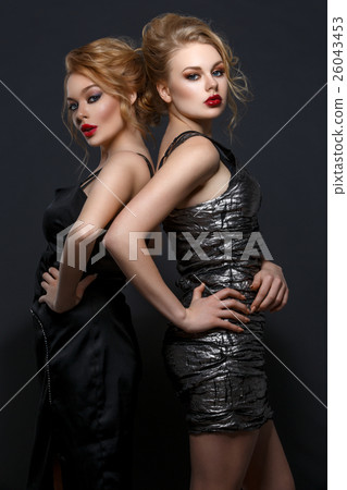 Two beautiful girls in evening dresses Two beautiful girls in evening dresses 26043453