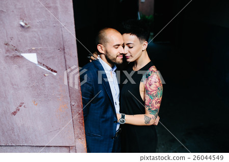 man and woman hugging in the doorway man and woman hugging in the doorway 26044549