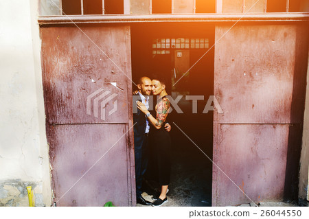 man and woman hugging in the doorway man and woman hugging in the doorway 26044550