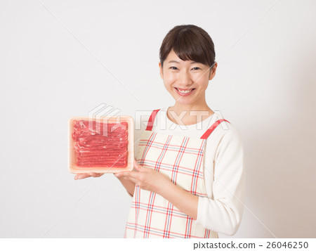 A woman with meat with a smile A woman with meat with a smile 26046250