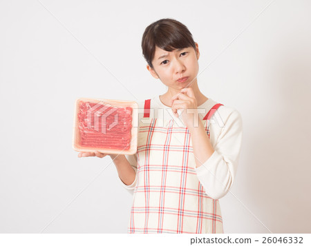 A woman with anxious face and meat 26046332