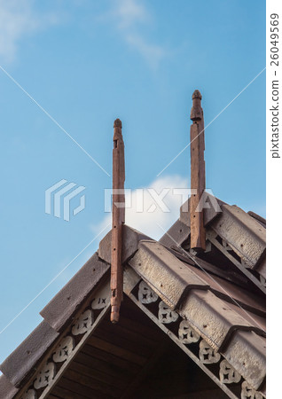 Roof trimmed with blue sky. 26049569